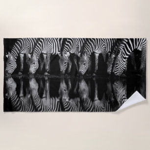 Group of Plains Zebra Drink Together at Night Beach Towel