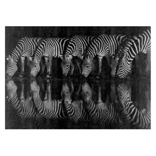 Group of Plains Zebra Drink Together at Night Cutting Board (Front)
