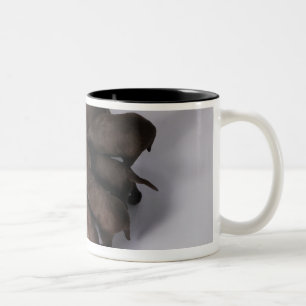 Group of puppies with heads together Two-Tone coffee mug