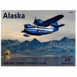 Grumman G-21 Goose Cutout<br><div class="desc">A postage stamp of a fictitious independent Alaska depicting a Grumman G-21 Goose amphibious airplane in service with the Alaska State Troopers over water with mountains in the background. Text reading, Alaska", "POSTAGE 20 NUGGETS" and "Alaska State Troopers Grumman G-21 Goose" also appear. The Grumman Goose was developed in 1936...</div>