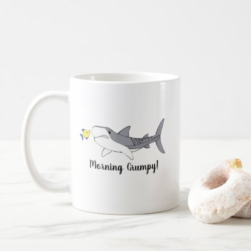 Grumpy tiger shark and cute yellow fish coffee mug