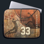 Grungy Basketball Sleeve<br><div class="desc">Silhouettes of two basketball players flying to the hoop for the reverse dunk and slam dunk - basketball theme graphics composite of basketball, hoop and court with grunge effect and customizable name and jersey number by katz_d_zynes</div>
