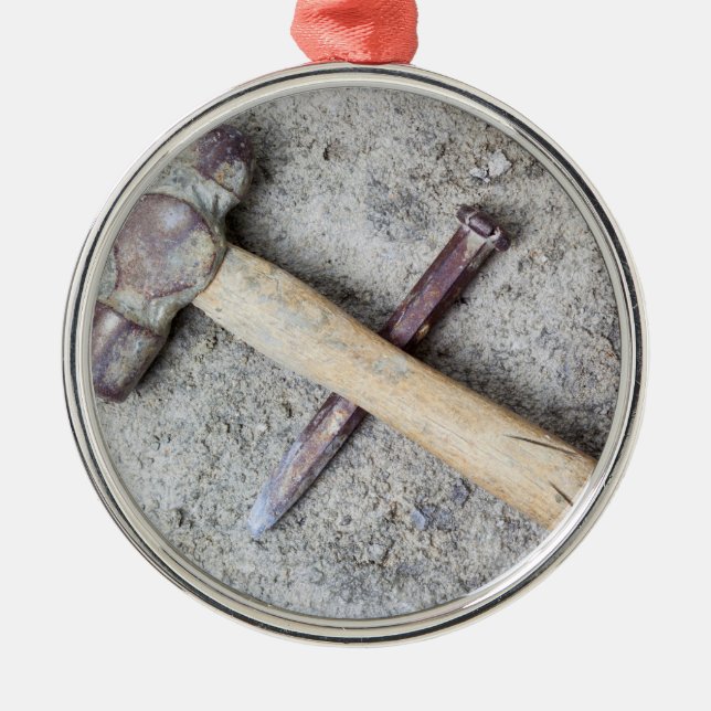 Grungy hammer and chisel metal ornament (Front)