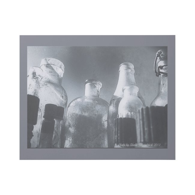 Grungy Monochrome Photo of Antique Glass Bottles