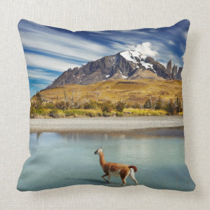 Guanaco crossing the river in Torres del Paine Throw Pillow