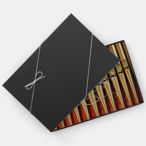 Guestbook for visiting organists with gold and red