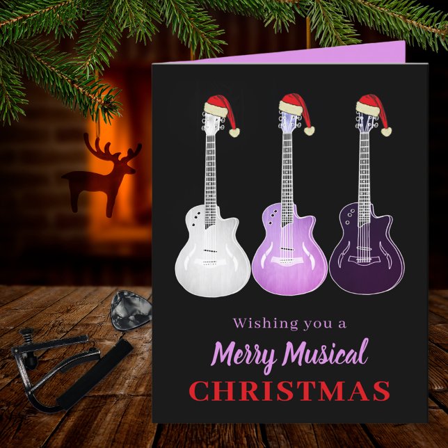 Guitar Christmas Merry Musical Pink Holiday Card (Merry musical Christmas guitars wearing Santa hats pink & black custom holiday greetings folded card)