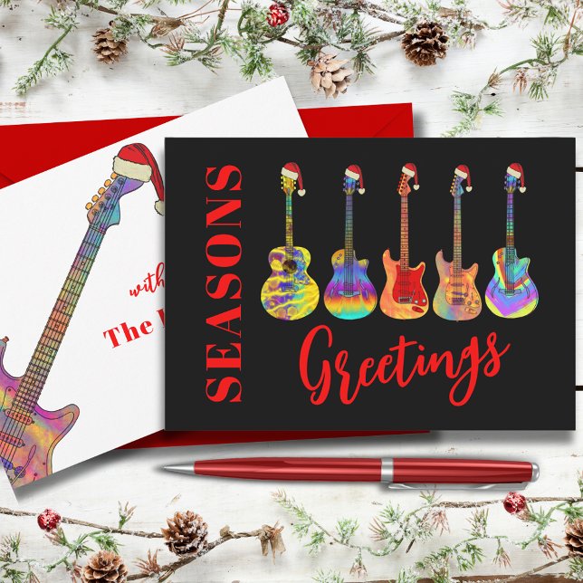 Guitars Wearing Santa Hats Seasons Greetings Holiday Card (Cool guitars seasons greetings funny colorful guitars wearing Santa hats on black background )