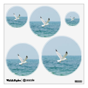 Gull flying above sea wall decal