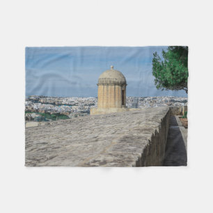 Gun turret on old city walls in Valletta, Malta Fleece Blanket