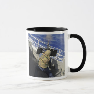 Gunners Mate firing a 50 caliber machine gun Mug