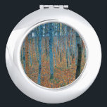 Gustav Klimt Beech Tree Forest Grove Compact Mirror<br><div class="desc">This is based on classic nature painting artworks by Gustav Klimt, Beech Grove 1, 1902. The artwork portrays a dense forest of tall, slender birch trees, with pale trunks marked by dark, vertical lines. The foliage is depicted in shades of blue, green, and yellow, adding a sense of depth and...</div>