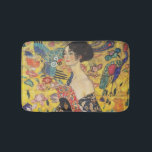 Gustav Klimt Lady With Fan Art Nouveau Painting Bathroom Mat<br><div class="desc">Gustav Klimt Lady With Fan Art Nouveau Painting This half portrait of a beautiful woman shows a yellow background with asiatic ornaments, colorful birds and lotus flowers. The lady wears a dress in the style of a kimono imprinted with motives of a Chinese dragon dress. Beautiful artistic romantic decorative fine...</div>