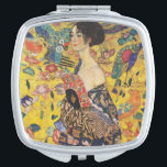 Gustav Klimt Lady With Fan Art Nouveau Painting Makeup Mirror<br><div class="desc">Gustav Klimt Lady With Fan Art Nouveau Painting This half portrait of a beautiful woman shows a yellow background with asiatic ornaments, colorful birds and lotus flowers. The lady wears a dress in the style of a kimono imprinted with motives of a Chinese dragon dress. Beautiful artistic romantic decorative fine...</div>