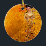 Gustav Klimt Portrait of Adele Bloch Bauer Ceramic Ornament<br><div class="desc">Ornament featuring Gustav Klimt’s oil painting Portrait of Adele Bloch Bauer I (1907). A beautiful woman wears a golden and geometric dress in front of a gold background. A great gift for fans of Art Nouveau and Austrian art.</div>