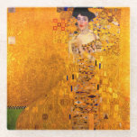 Gustav Klimt Portrait of Adele Bloch Bauer Glass Coaster<br><div class="desc">Glass Coaster featuring Gustav Klimt’s oil painting Portrait of Adele Bloch Bauer I (1907). A beautiful woman wears a golden and geometric dress in front of a gold background. A great gift for fans of Art Nouveau and Austrian art.</div>