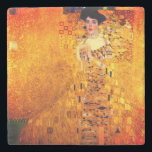 Gustav Klimt Portrait of Adele Bloch Bauer Stone Coaster<br><div class="desc">Stone Coaster featuring Gustav Klimt’s oil painting Portrait of Adele Bloch Bauer I (1907). A beautiful woman wears a golden and geometric dress in front of a gold background. A great gift for fans of Art Nouveau and Austrian art.</div>