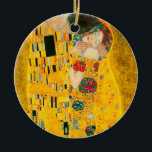 Gustav Klimt The Kiss Ceramic Ornament<br><div class="desc">Ornament featuring Gustav Klimt’s oil painting with gold leaf The Kiss (1908). A man and woman,  wearing brilliant golden colors,  lovingly embrace and kiss in a field of flowers. A great gift for fans of Art Nouveau and Austrian art.</div>