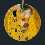 Gustav Klimt The Kiss Ceramic Ornament<br><div class="desc">Ornament featuring Gustav Klimt’s oil painting with gold leaf The Kiss (1908). A man and woman,  wearing brilliant golden colors,  lovingly embrace and kiss in a field of flowers. A great gift for fans of Art Nouveau and Austrian art.</div>