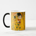 Gustav Klimt The Kiss Magic Mug<br><div class="desc">Magic Mug featuring Gustav Klimt’s oil painting with gold leaf The Kiss (1908). A man and woman,  wearing brilliant golden colors,  lovingly embrace and kiss in a field of flowers. A great gift for fans of Art Nouveau and Austrian art.</div>