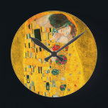 Gustav Klimt The Kiss Round Clock<br><div class="desc">Clock featuring Gustav Klimt’s oil painting with gold leaf The Kiss (1908). A man and woman,  wearing brilliant golden colors,  lovingly embrace and kiss in a field of flowers. A great gift for fans of Art Nouveau and Austrian art.</div>