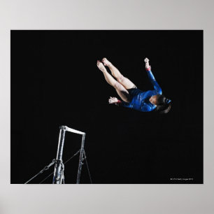 Gymnast (16-17) dismounting uneven bars poster