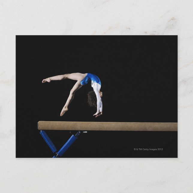 Gymnast (9-10) flipping on balance beam, side postcard (Front)