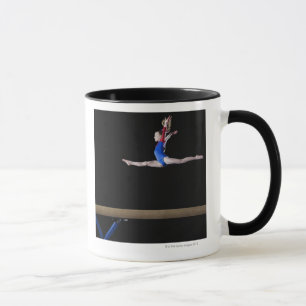 Gymnast (9-10) leaping on balance beam 2 mug
