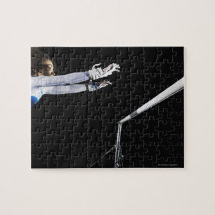 Gymnast (9-10) reaching for uneven bars 2 jigsaw puzzle