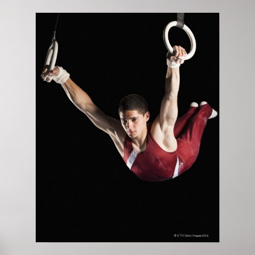 Gymnast swinging from rings poster