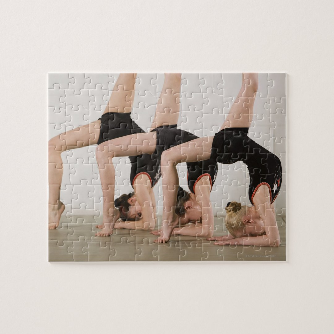 Gymnasts posing upside down jigsaw puzzle Zazzle