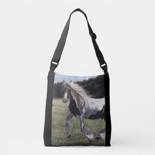 Gypsy vanner pinto horse running in field crossbody bag