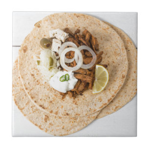 Gyros pita with tzatziki coleslaw olives and feta ceramic tile