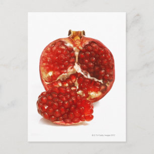 Half a ripe pomegranate cut to expose the juicy postcard