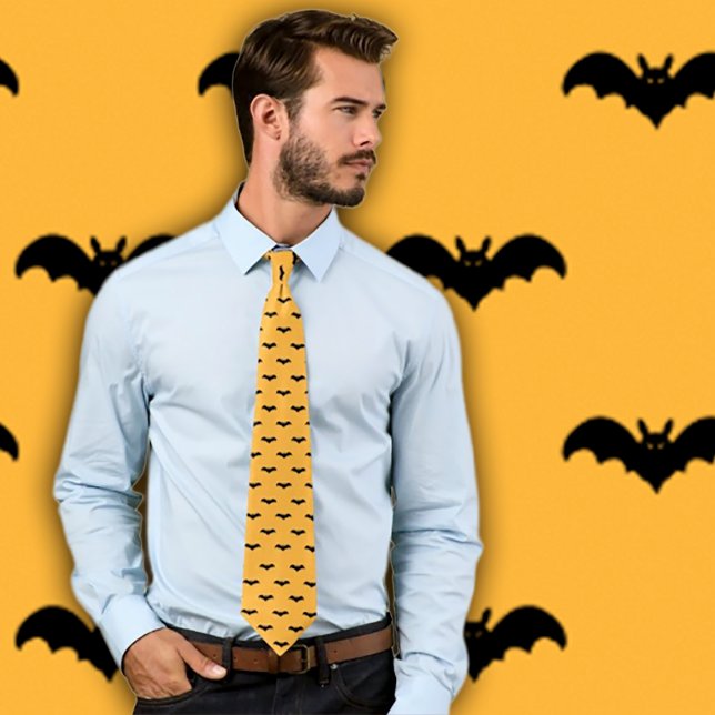 Halloween Bats- Black and Orange Neck Tie (Man wears an orange necktie with a pattern of black bats.  Background matches necktie pattern. )