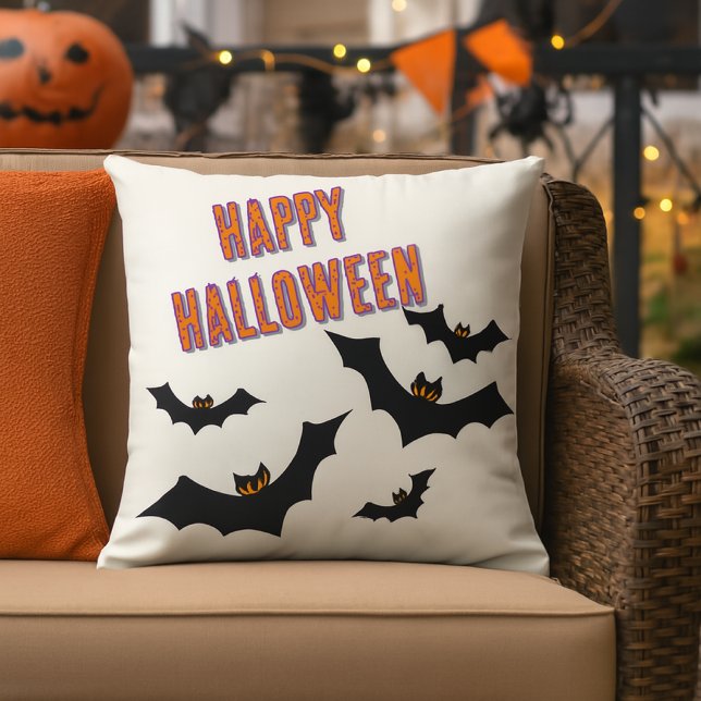 Halloween Bats Porch / Patio  Outdoor Pillow (The outdoor pillow features a bold “Happy Halloween” design with jagged-winged bats )