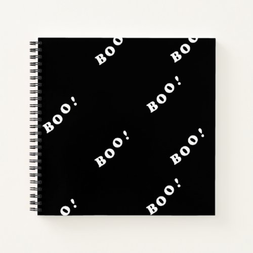 Halloween boo words on black notebook