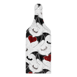 Halloween heart with black bat wings cutting board
