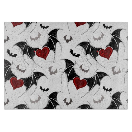 Halloween heart with black bat wings cutting board