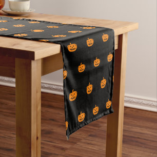 Halloween party table runner with pumpkin heads