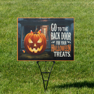 Halloween sign leading kids to treats