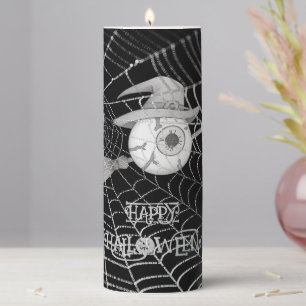 Halloween witch broom, scary eyeball, spider web pillar candle