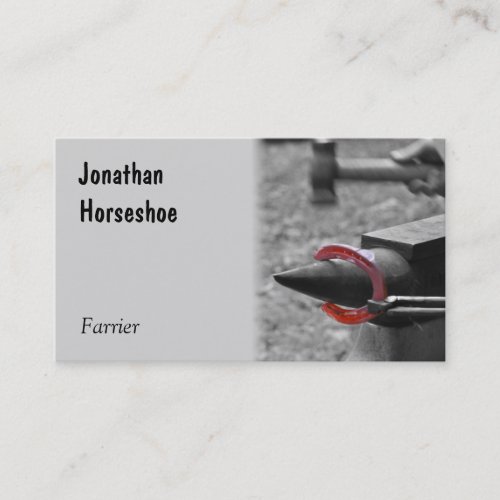 Hammering a red hot shoe on an anvil business card