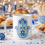 Hamsa Star of David Blue Boho Coffee Mug<br><div class="desc">This blue Hamsa coffee mug features an intricate mandala-style Hand of Fatima design with a central Star of David, blending spiritual symbolism with modern boho artistry. The layered turquoise, navy, and gold-inspired detailing creates a calming yet eye-catching focal point that feels meaningful without overwhelming your space. It’s a design that...</div>