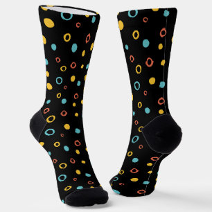 Hand drawn colorful circle pattern on a black socks