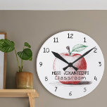 Hand Drawn Cute & Fun Red Apple Teacher Classroom Round Clock<br><div class="desc">Make every moment in the classroom special with this Hand-Drawn Cute & Fun Red Apple Teacher Classroom Round Clock! Featuring a charming hand-drawn apple with vibrant red, green, and brown tones on a crisp white background, this stylish clock adds a fun and personal touch to any teacher’s space. Customize it...</div>
