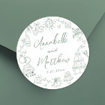 Hand Drawn Green Whimsical Wedding Classic Round Sticker<br><div class="desc">Personalized Hand-Drawn Quirky Sage Green Wedding Stickers. These fun and playful round wedding stickers feature quirky doodle illustrations surrounding the edges, all in a soft sage green theme. Elements like a champagne tower, wedding cake, disco ball, hearts, wedding bells, rings, cameras, and more create a whimsical and celebratory vibe. The...</div>