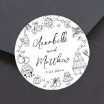 Hand Drawn Quirky Whimsical Wedding Classic Round Sticker<br><div class="desc">Personalized Hand-Drawn Quirky Black and White Wedding Stickers. These fun and playful round wedding stickers feature quirky doodle illustrations surrounding the edges, all in bold black against a crisp white background. Elements like a champagne tower, wedding cake, disco ball, hearts, wedding bells, rings, cameras, and more create a whimsical and...</div>
