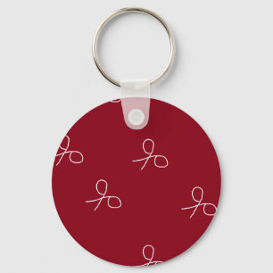 Hand drawn scissors on maroon red keychain