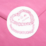 Hand Drawn Vintage Cake Whimsical Pink Wedding Classic Round Sticker<br><div class="desc">Personalized Vintage Cake Wedding Monogram Stickers. These custom round wedding stickers feature a simple vintage-style cake illustration at the center, topped with the couple’s monogram initials and wedding date for a timeless and elegant touch. The minimalist design uses a mix of handwritten and script fonts in cute baby pink, keeping...</div>